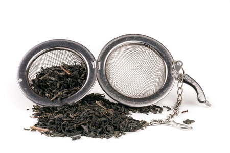tea strainer on a chain isolated white background