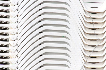 stack of the deck chairs on the beach as a backgroundの写真素材