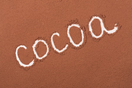 word cocoa written in cocoa powder as backgroundの写真素材