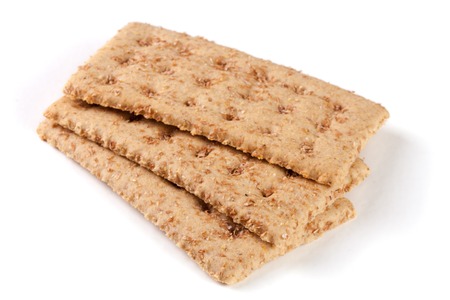 three grain crispbreads isolated on white backgroundの写真素材