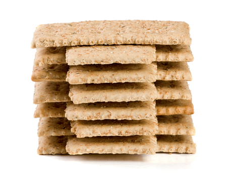 stack of grain crispbreads isolated on white backgroundの写真素材
