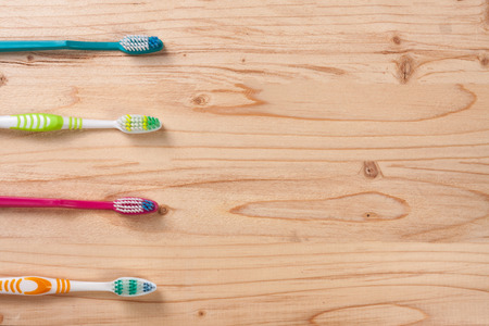 manual toothbrushes on the light wooden background with copy space for your text. Top view.の写真素材