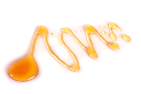 Honey stain isolated on a white backgroundの写真素材