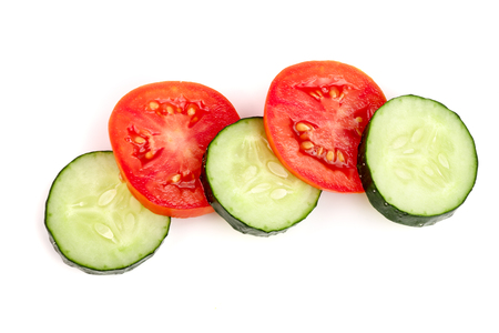 tomato and cucumber slice isolated on white background. Top viewの写真素材