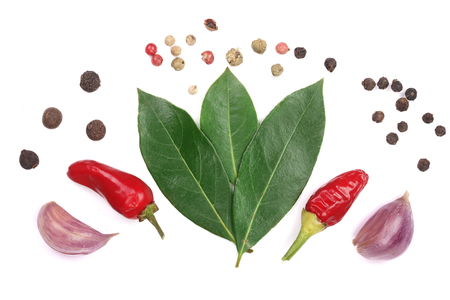 mix of garlic, hot pepper, peppercorn and laurel leaf isolated on white background. Top viewの写真素材