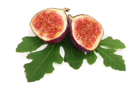 fig fruits with leaves isolated on white backgroundの写真素材