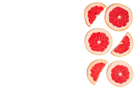 Grapefruit slices isolated on white background with copy space for your text. Top view. Flat lay pattern.の写真素材