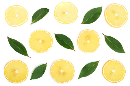 Slices lemon with leaves isolated on white background. Flat lay, top viewの写真素材