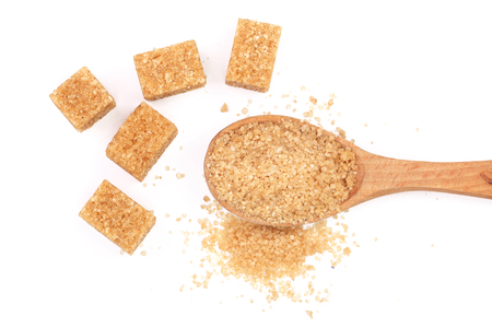 brown sugar in wooden spoon isolated on white background. Top view. Flat layの写真素材
