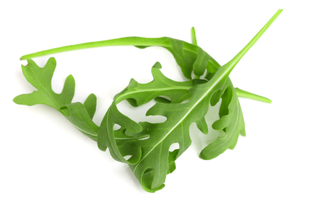 Heap of Green fresh rucola or arugula leaf isolated on white background.の写真素材