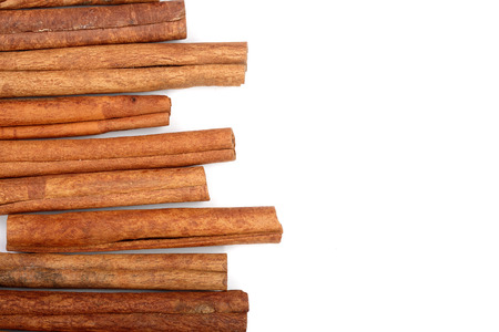 Cinnamon sticks isolated on white background with copy space for your text. Top viewの写真素材