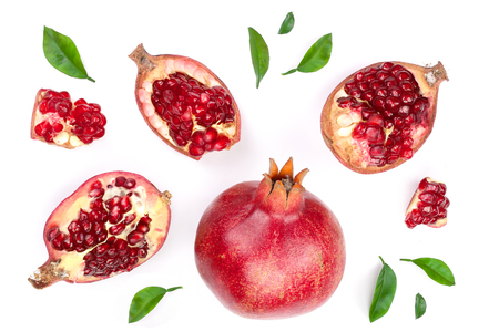pomegranate with leaves isolated on white background. Top view. Flat lay pattern.の写真素材
