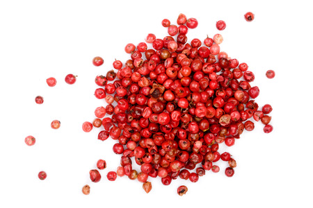 pink peppercorns seeds isolated on white background. Top view. Flat lay.の写真素材
