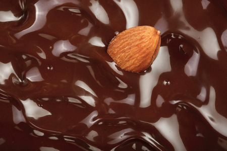Melted chocolate swirl as a background closeup.の写真素材