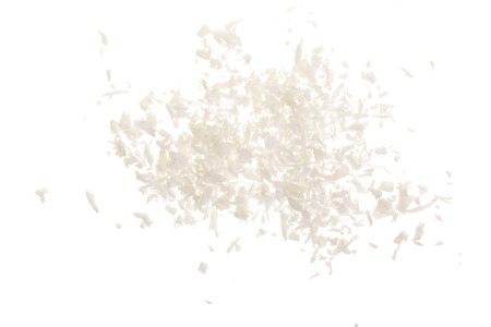 Heap of coconut flakes isolated on white backgroundの写真素材
