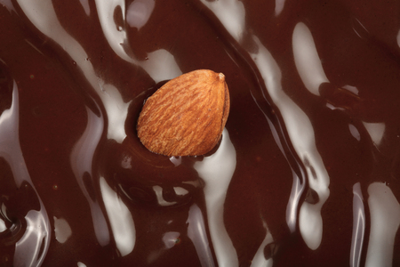 Melted chocolate swirl as a background closeup.の写真素材