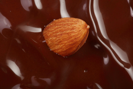Melted chocolate swirl as a background closeup.の写真素材