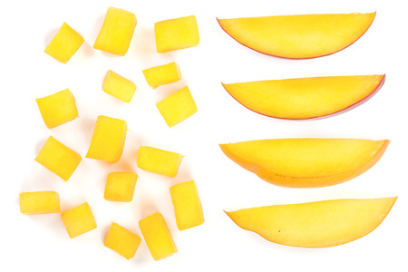 cube and slices of Mango fruit isolated on white background close-up. Top view. Flat lay.の写真素材