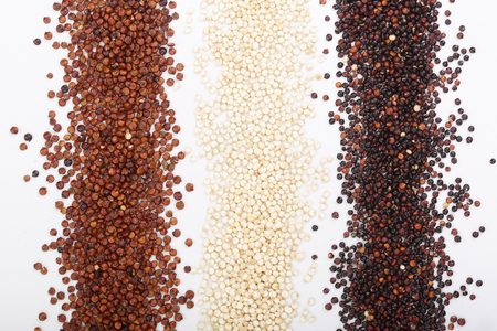 Black red and white quinoa seeds isolated on white background. Top view.の写真素材