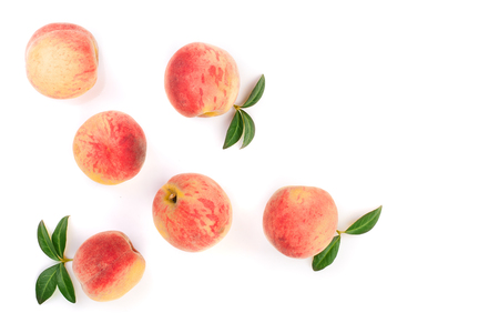 ripe peaches with leaves isolated on white background with copy space for your text. Top view. Flat lay pattern.の写真素材