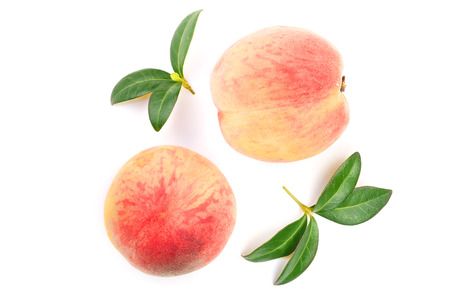 ripe peaches with leaves isolated on white background. Top view. Flat lay patternの写真素材