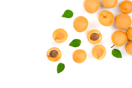 Apricot fruits with leaves isolated on white background with copy space for your text. Top view. Flat lay pattern.の写真素材