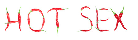 Word sex written from red hot pepper letters isolated on white backgroundの写真素材