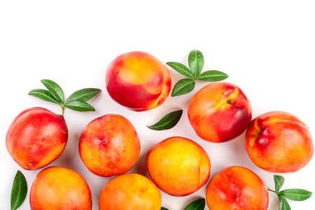 ripe nectarine with leaves isolated on white background with copy space for your text. Top view. Flat lay pattern.の写真素材