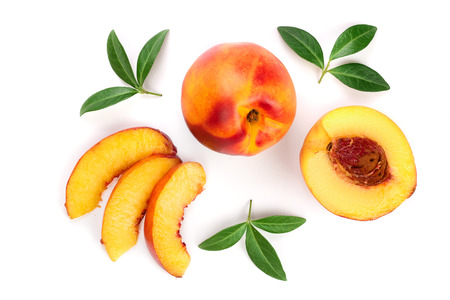 ripe nectarine with leaves isolated on white background. Top view. Flat lay pattern.の写真素材