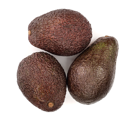 three whole avocado isolated on white background. Top view. Flat lay.の写真素材