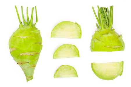 Fresh kohlrabi with green leaves isolated on white backround. Top view. Flat layの写真素材