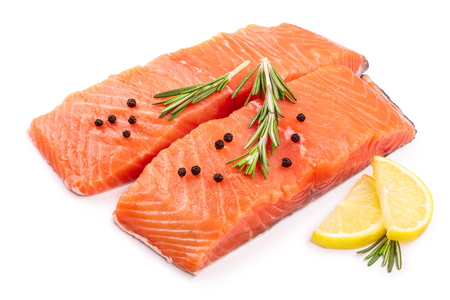 fillet of red fish salmon with lemon and rosemary isolated on white background.の写真素材