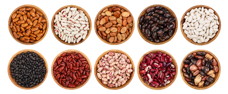 mix legumes in wooden bowl isolated on white background