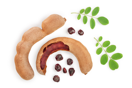 Tamarind fruit with leaf and seed isolated on white background, Top view. Flat layの写真素材