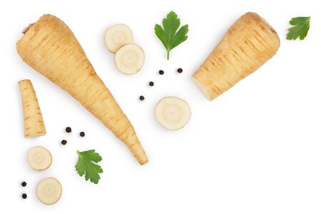 Parsnip root and slices with parsley peppercorns isolated on white background with copy space for your text. Top view. Flat lay,の写真素材