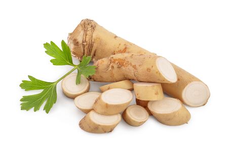 Horseradish root with slices and parsley isolated on white background.の写真素材