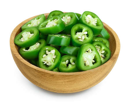 sliced jalapeno pepper in wooden bowl isolated on white background.の写真素材