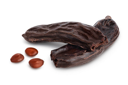 Ripe carob pods and bean isolated on white background with clipping path and full depth of fieldの写真素材