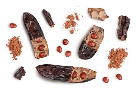 Carob pod and powder isolated on white background with clipping path and full depth of field. Top view. Flat layの写真素材