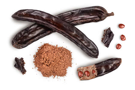Carob pod and powder isolated on white background with clipping path and full depth of field. Top view. Flat layの写真素材