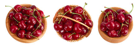 red sweet cherry in wooden bowl isolated on white background with full depth of field, Set or collection. Top view. Flat layの写真素材