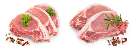 sliced raw pork meat with parsley and peppercorn isolated on white backgroundの写真素材
