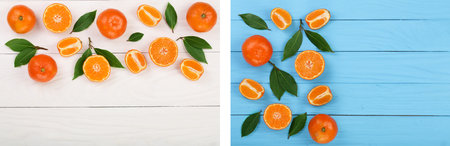 tangerine with leaves on blue wooden background with copy space for your text. Flat lay, top view....