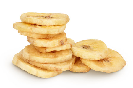 Dried banana chips isolated on white background with full depth of fieldの写真素材