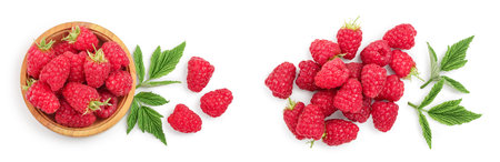 raspberries in wooden bowl with leaves isolated on white background. Top view. Flat lay