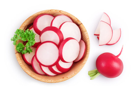 Radish slices in wooden bowl isolated on white background. Top view. Flat lay