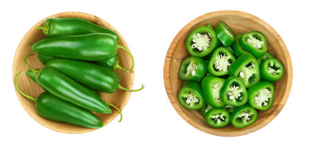 jalapeno pepper in wooden bowl isolated on white background. Green chili pepper. Top view. Flat layの写真素材