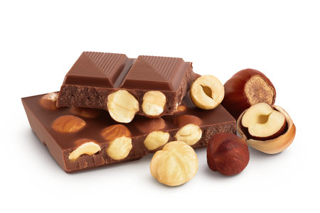 Chocolate with hazelnuts isolated on white background with full depth of field.の写真素材