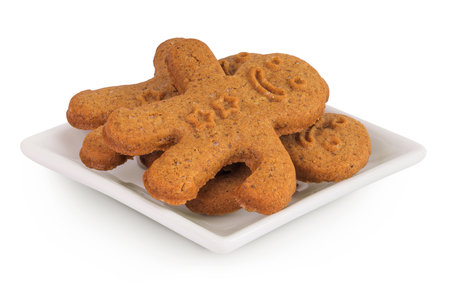 Gingerbread man in ceramic bowl isolated on white background