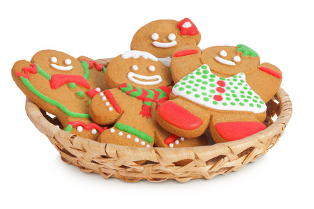 christmas gingerbread cookie in a wicker basket isolated on white background
